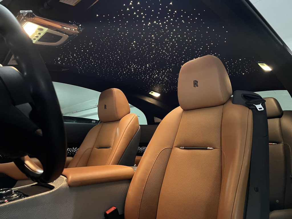 Rolls-Royce leather seats and starlight roof cleaned during a detailing package, shown from the front row.| none | leather seat cleaning | interior wipe down | detail brush work