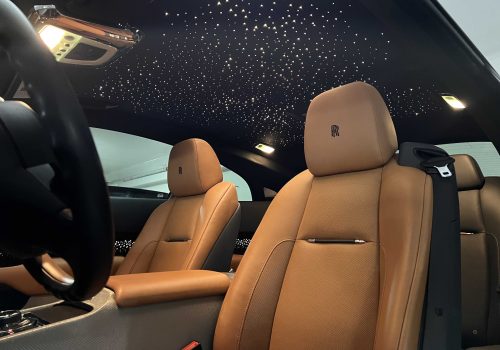 Rolls-Royce leather seats and starlight roof cleaned during a detailing package, shown from the front row.| none | leather seat cleaning | interior wipe down | detail brush work