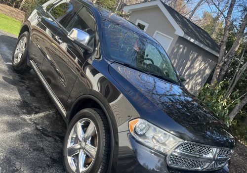 Clean black SUV exterior and reflections after exterior detailing in Halifax, Nova Scotia.| Halifax Waterfront | mobile hand wash | rinse and dry | window cleaning